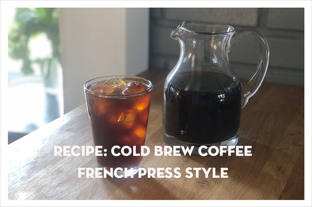 a glass of cold brew coffee with ice on a table